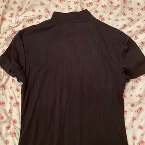 -Short sleeve turtle neck.                                -Eye Candy